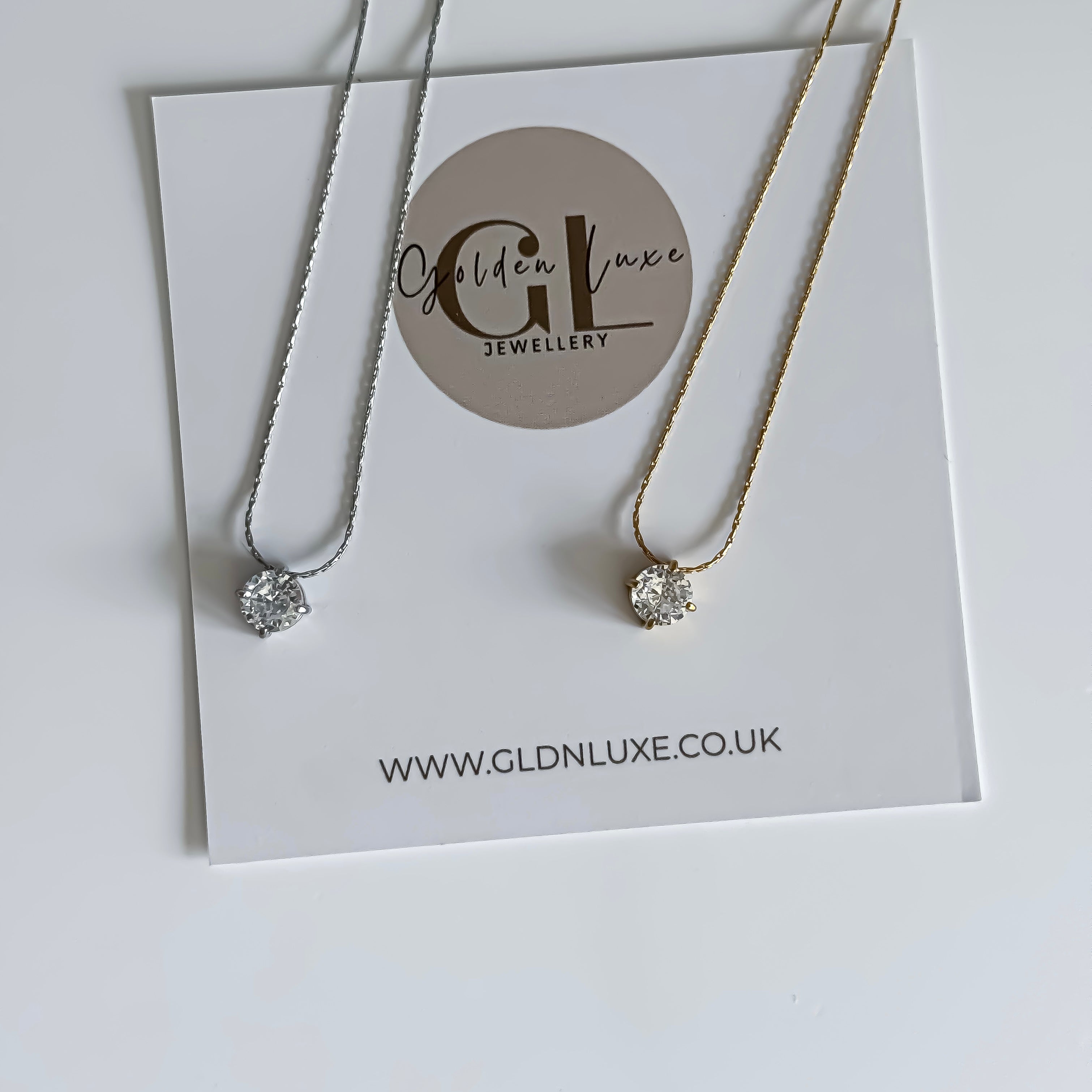 Necklace on a Golden Luxe Jewellery card with website URL.