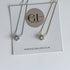 Necklace on a Golden Luxe Jewellery card with website URL.