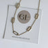 Gold necklace on a card with Golden Luxe Jewellery branding