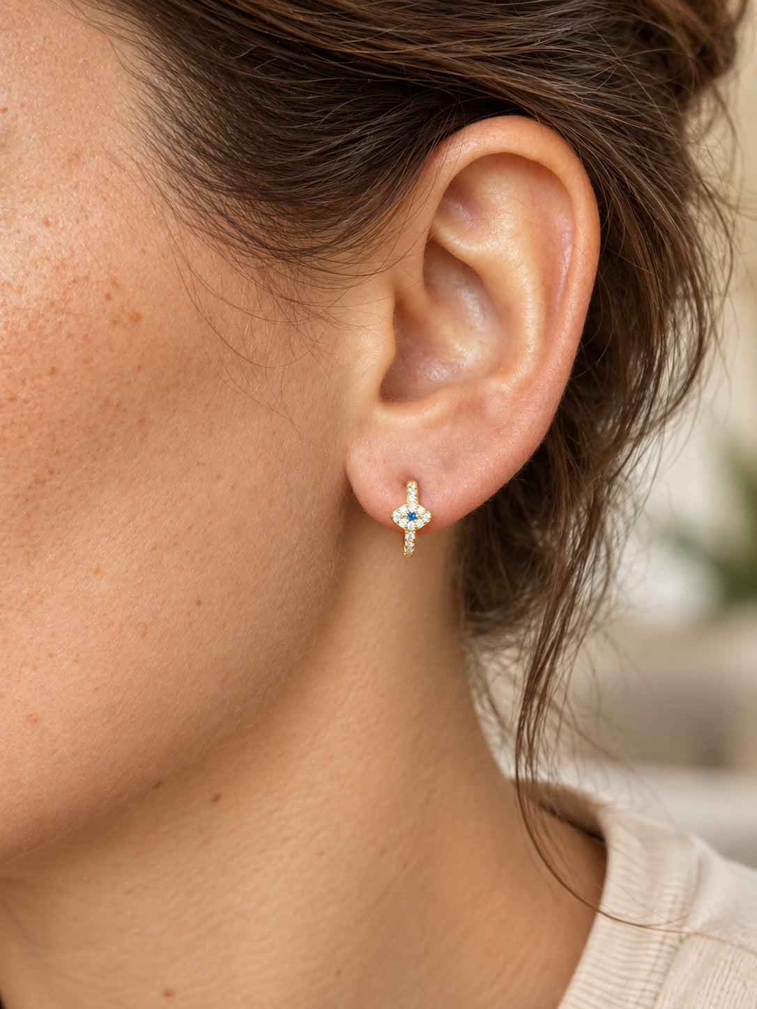 Petite evil eye huggie hoop earrings with CZ detailing