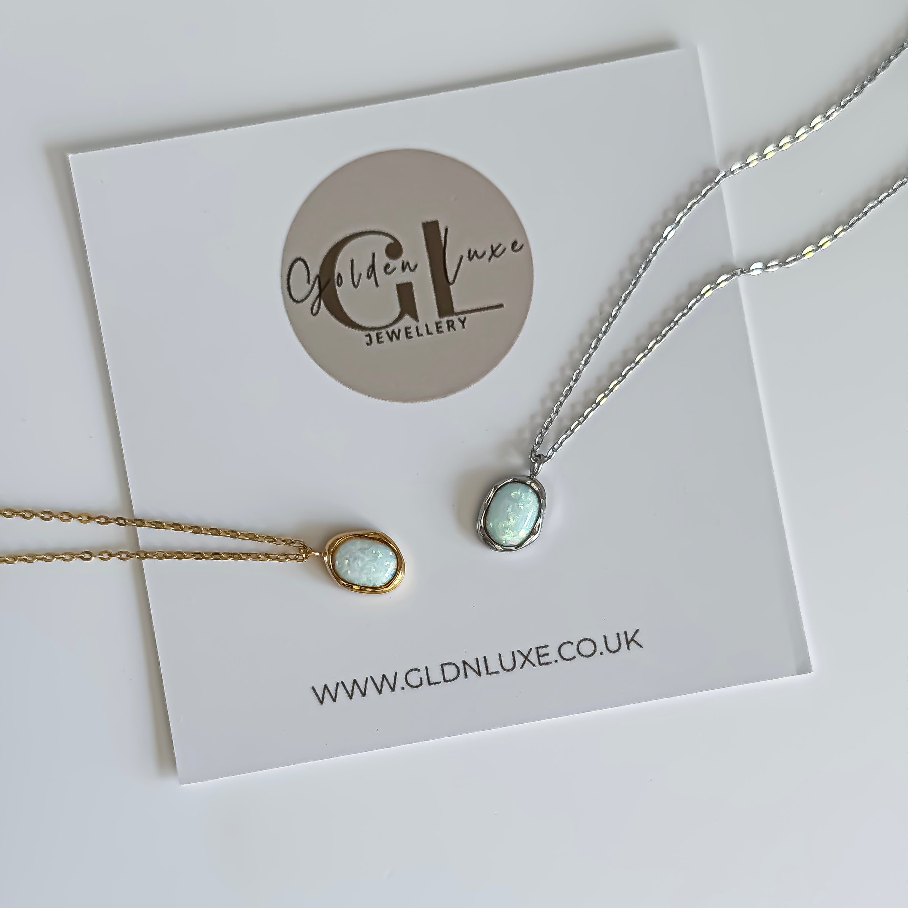 Two opal pendant necklaces on a card with Golden Luxe Jewellery branding.