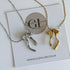 Two necklaces, one silver and one gold, on a card with 'Golden Luxe Jewellery' branding.