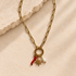Gold paperclip carabiner necklace with detachable charms