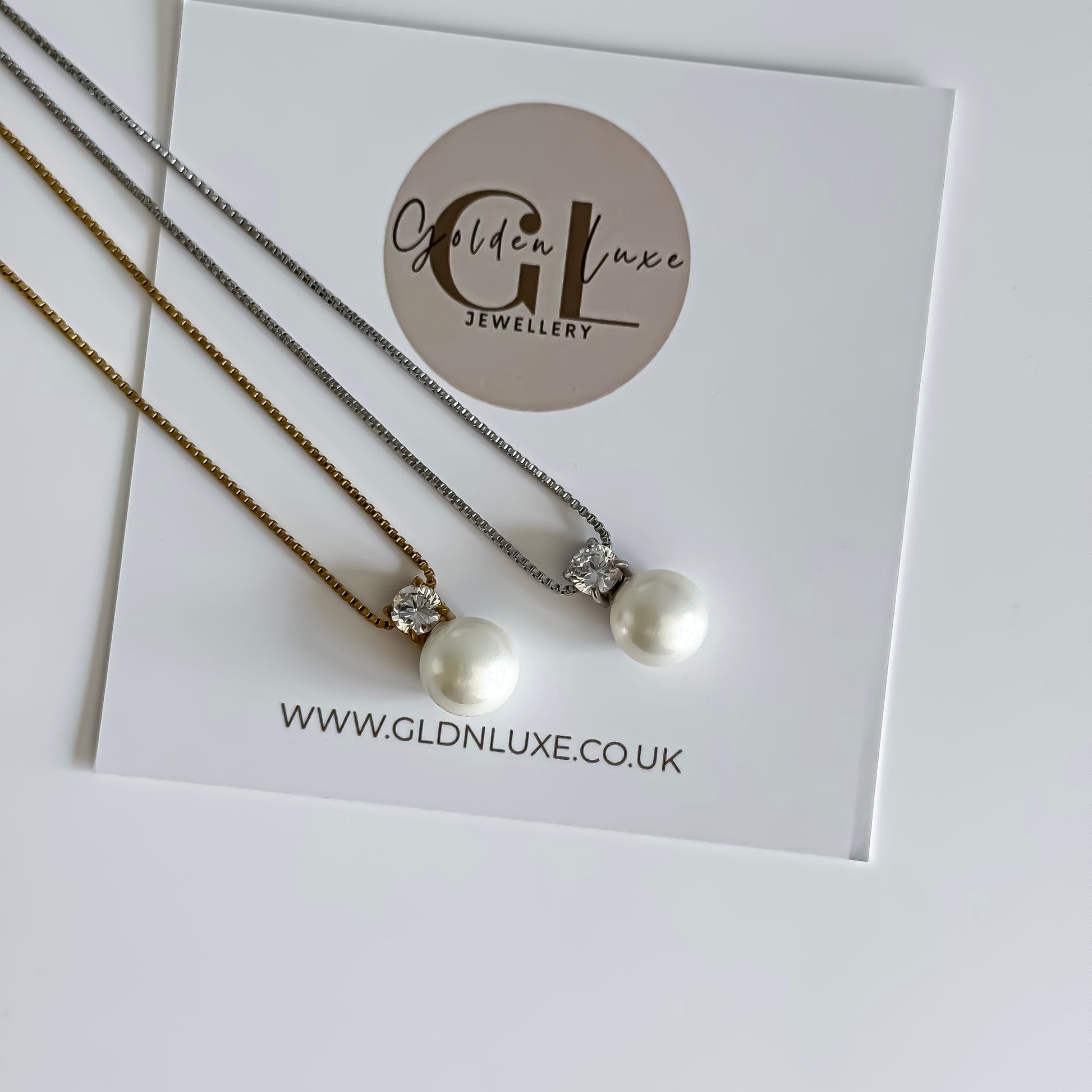 Two pearl necklaces on a card with GLDN Luxe Jewellery branding.