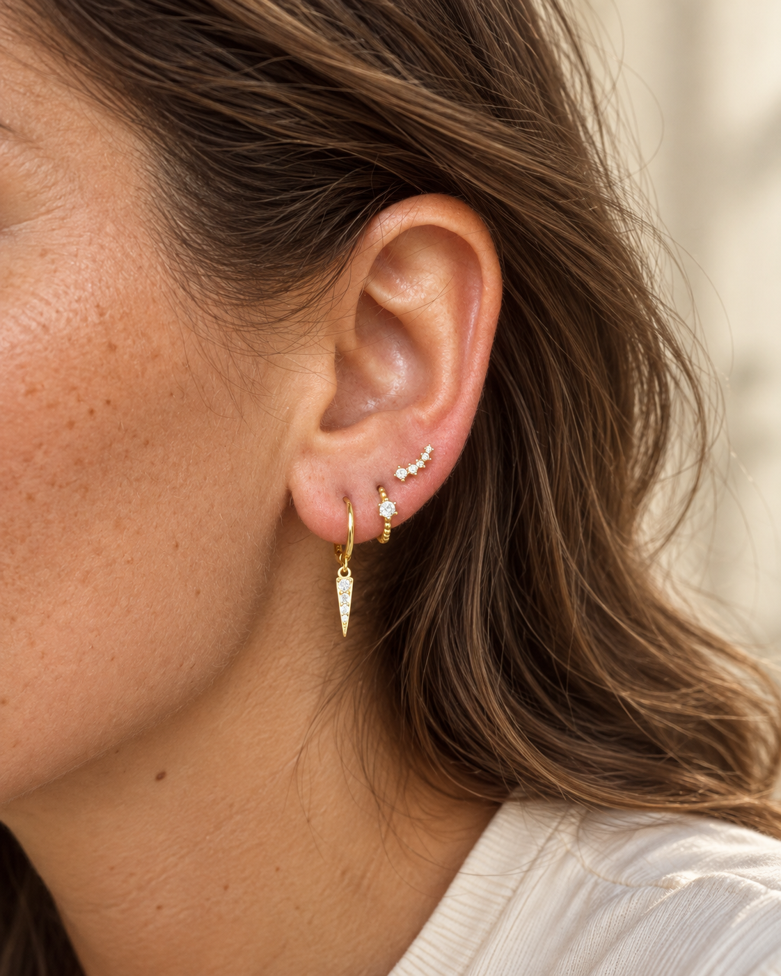 Lily sparkling CZ huggie earrings with delicate drop design