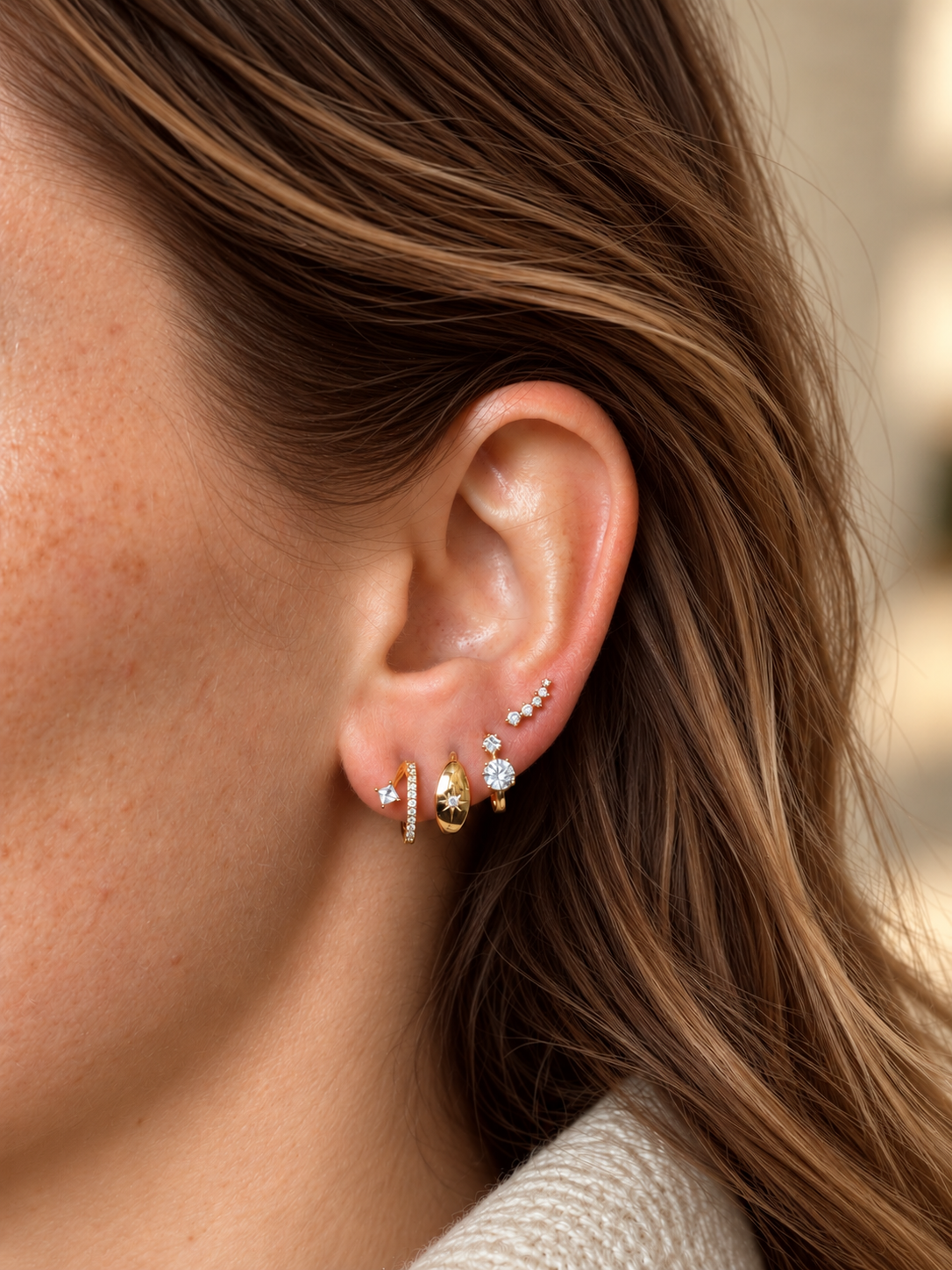 Celeste celestial starburst huggie earrings with sparkling CZ stones