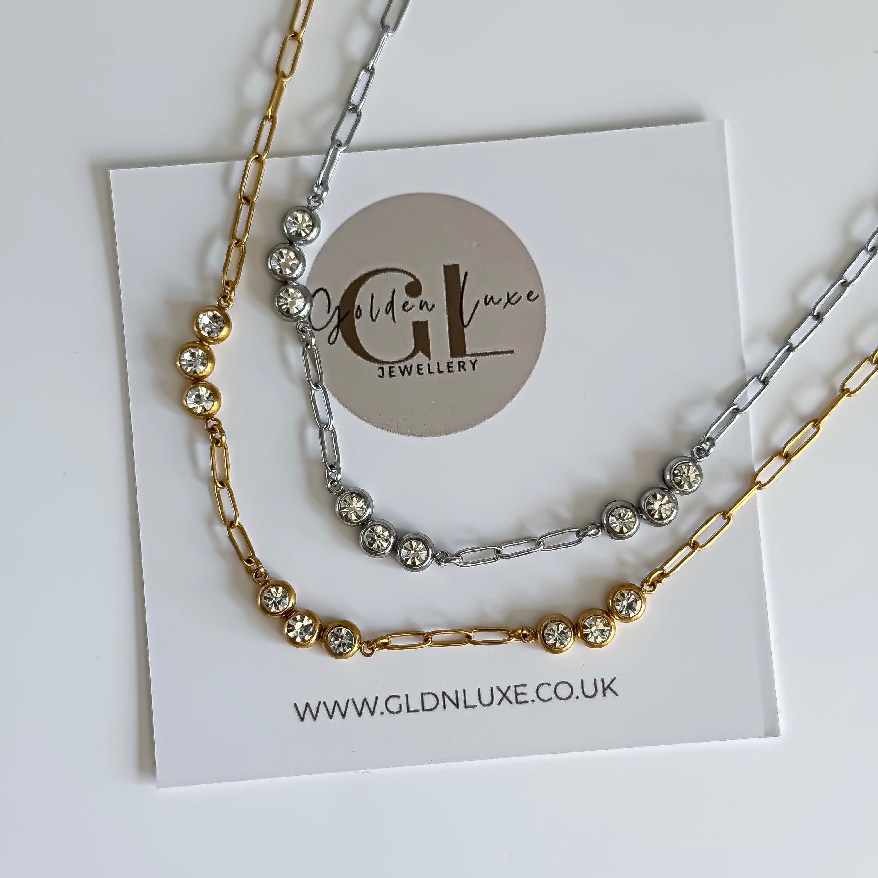 Gold and Silver Crystal link necklaces on a card with Golden Luxe Jewellery branding