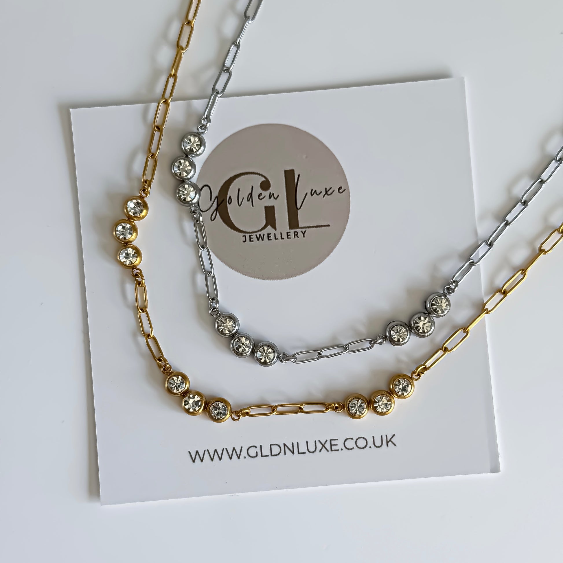 Gold and Silver Crystal link necklaces on a card with Golden Luxe Jewellery branding
