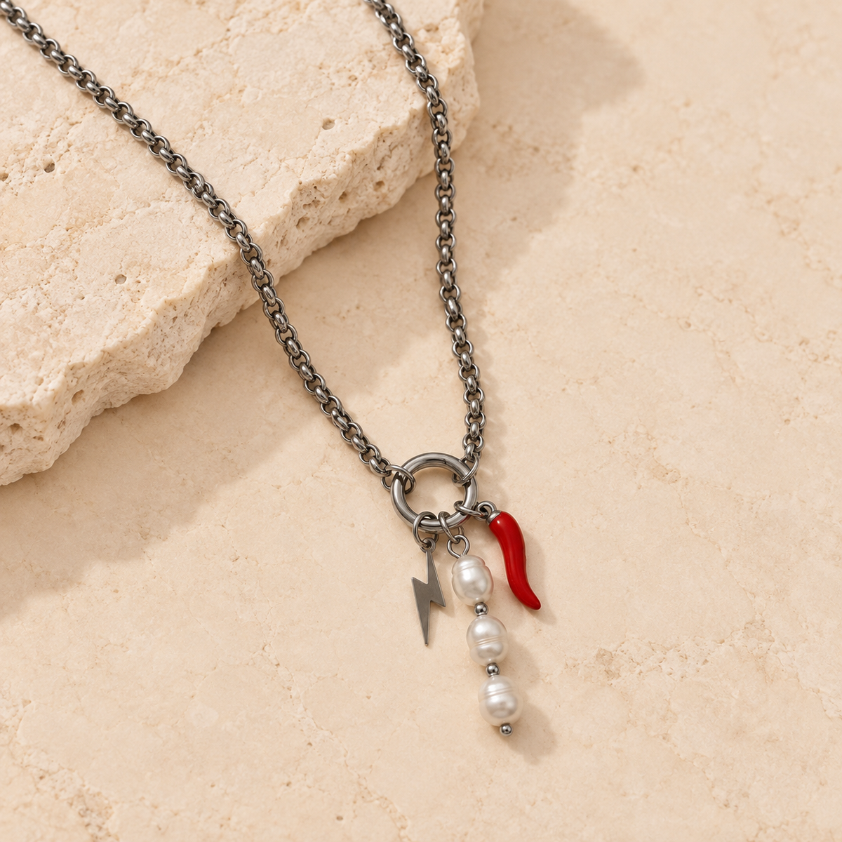 Silver rolo carabiner charm necklace with lightning bolt, pearl and red chilli charms