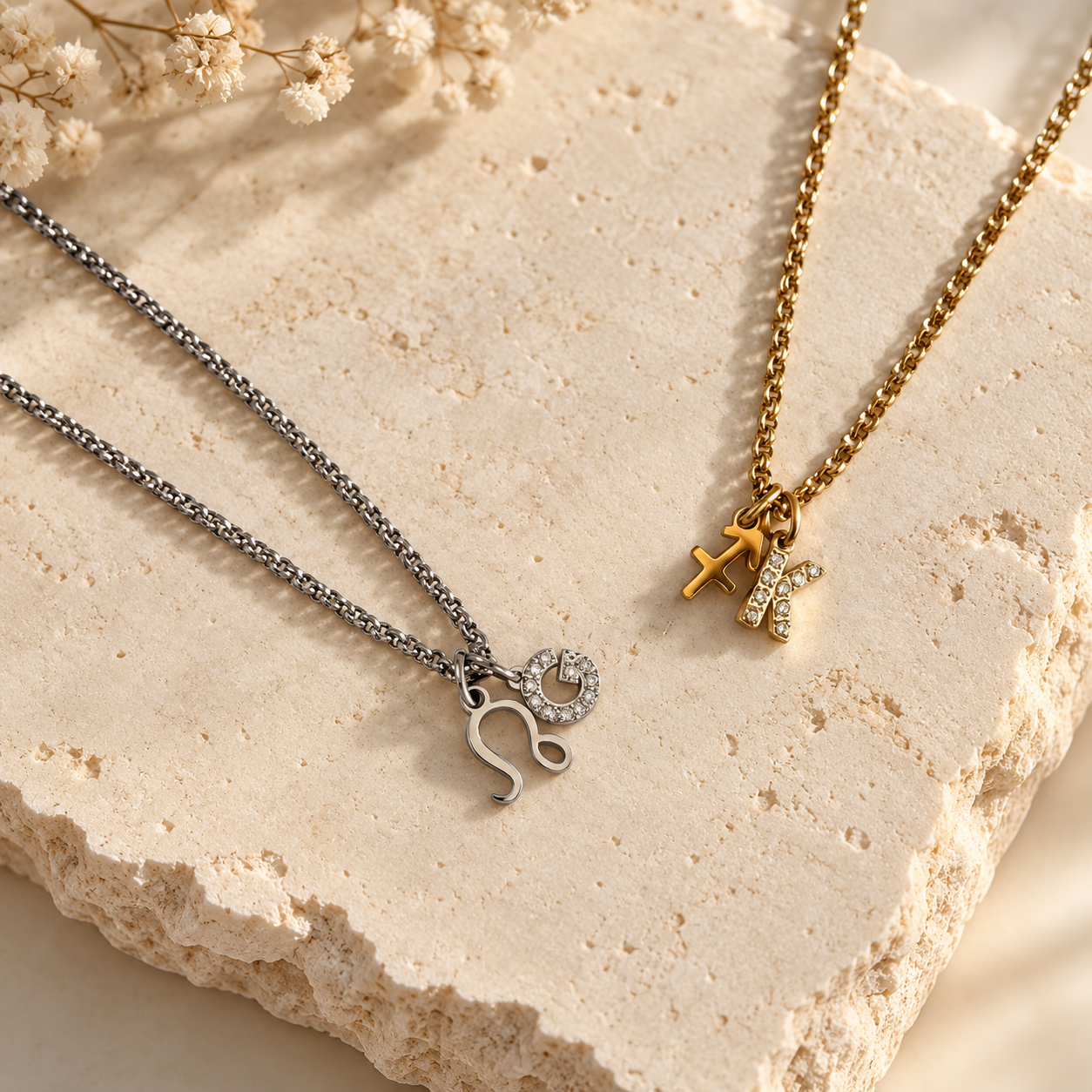 Gold and silver initial zodiac necklace with letter and star sign charms on a dainty rolo chain