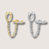 Two cuff huggie hoop earrings, one plated in gold and the other in silver, both adorned with cubic zirconia stones, displayed against a white background.