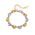Bracelet with gold and silver heart-shaped links on a white background